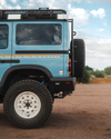 INEOS Grenadier vehicle with steel high clearance rear bumper off-road setup