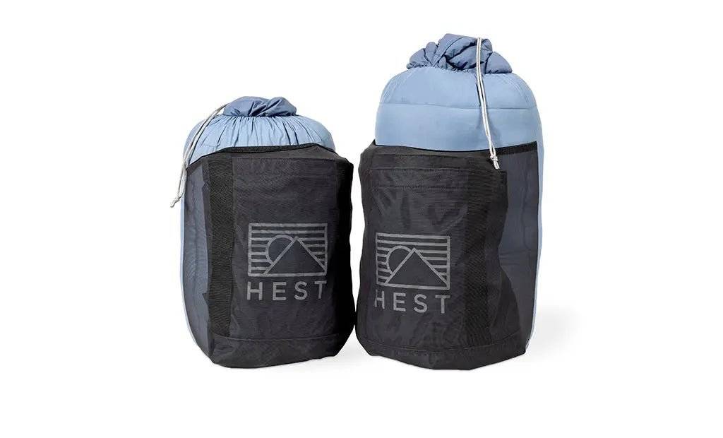 HEST Down Comforters in storage bags for durability and adventure-ready use.