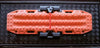 Maxtrax recovery board mounted on a locking quick release Maxtrax Mount on a textured black surface