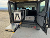 Grenadier Explore Series rear plate system with CampKitchen 2.2 and single drawer module in vehicle back for organized outdoor storage and cooking setup
