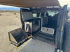 Grenadier Explore Series vehicle rear plate system with CampKitchen 2.2 and single drawer module in off-road desert setting