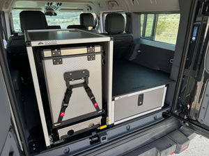 Grenadier Explore Series rear plate system and CampKitchen 2.2 with single drawer module installed in vehicle cargo area for organized storage and camping gear.
