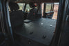 Explore Series Module Based Seat Delete installed in Ineos Grenadier showing flat lockable storage compartments and pillow extensions for tall users