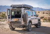 Grenadier Explore Series Side X Side Drawer Module installed in off-road vehicle with open rear doors and desert background