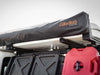 HD Awning Bracket for INEOS Grenadier supporting expedition awning on roof rack.