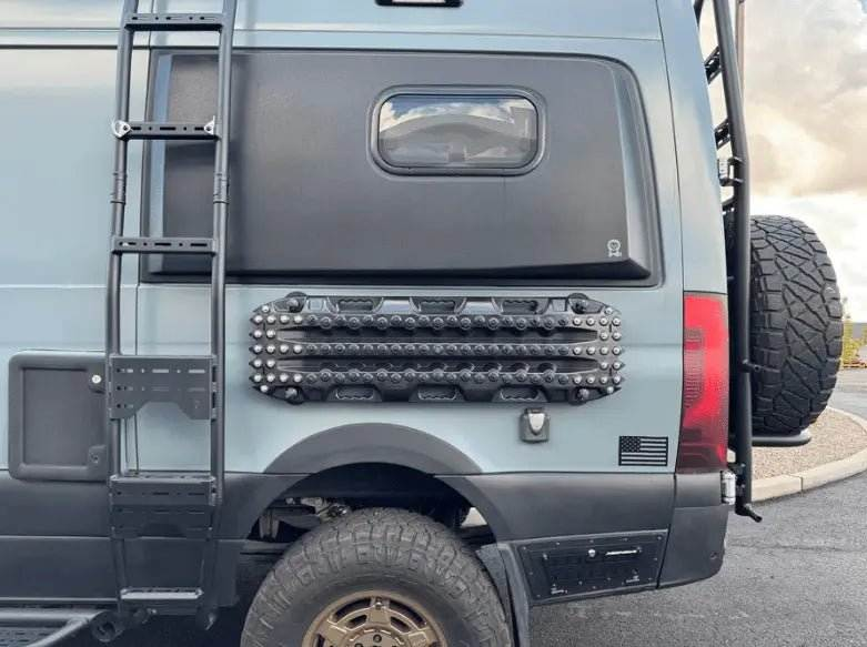 MKII Traction Boards mounted on an off-road vehicle for recovery assistance.