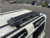 MKII Traction Boards mounted on vehicle roof, ideal for off-road recovery.
