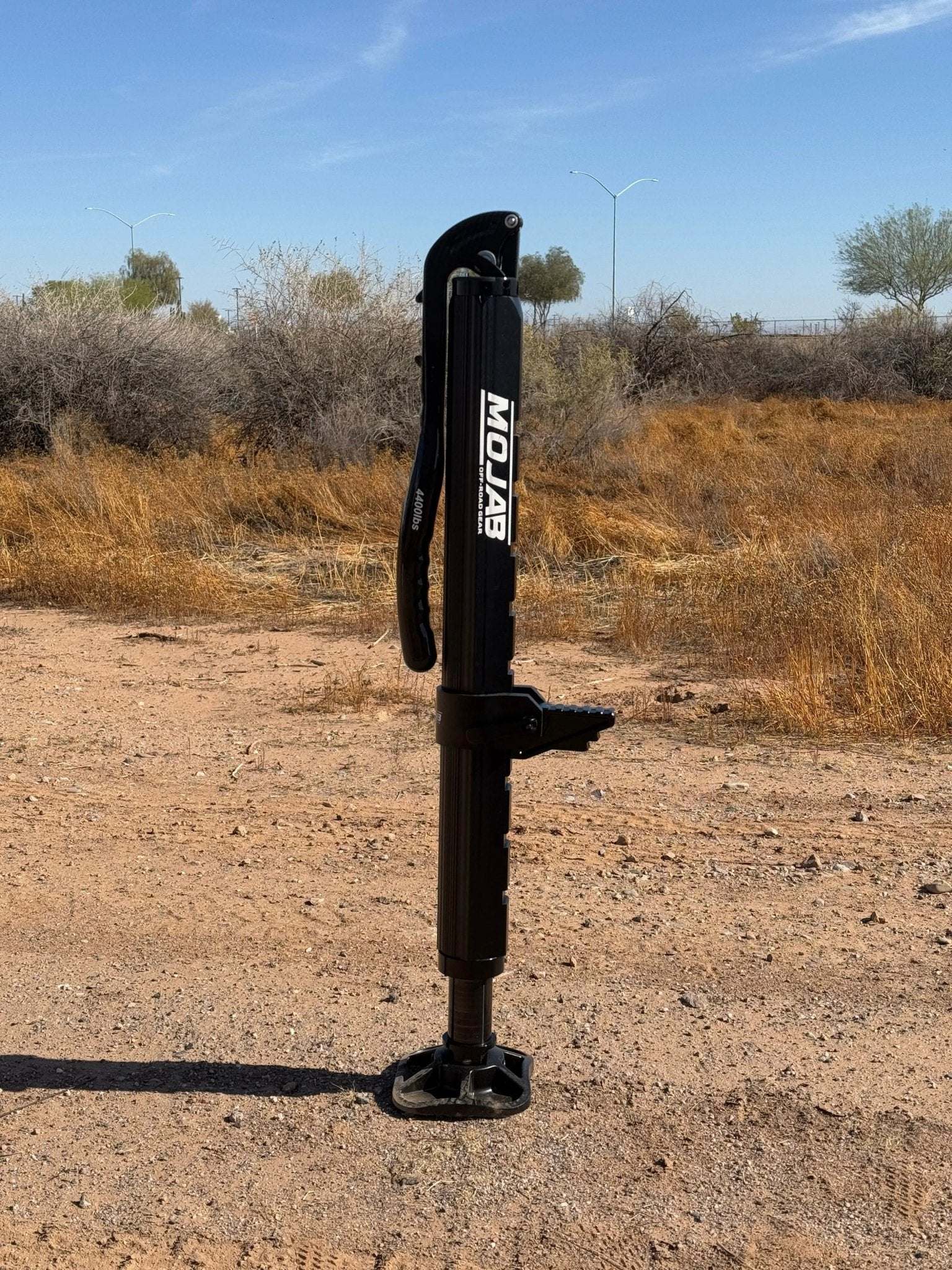 Hydraulic Jack with Mounts for INEOS Grenadier on rugged terrain.