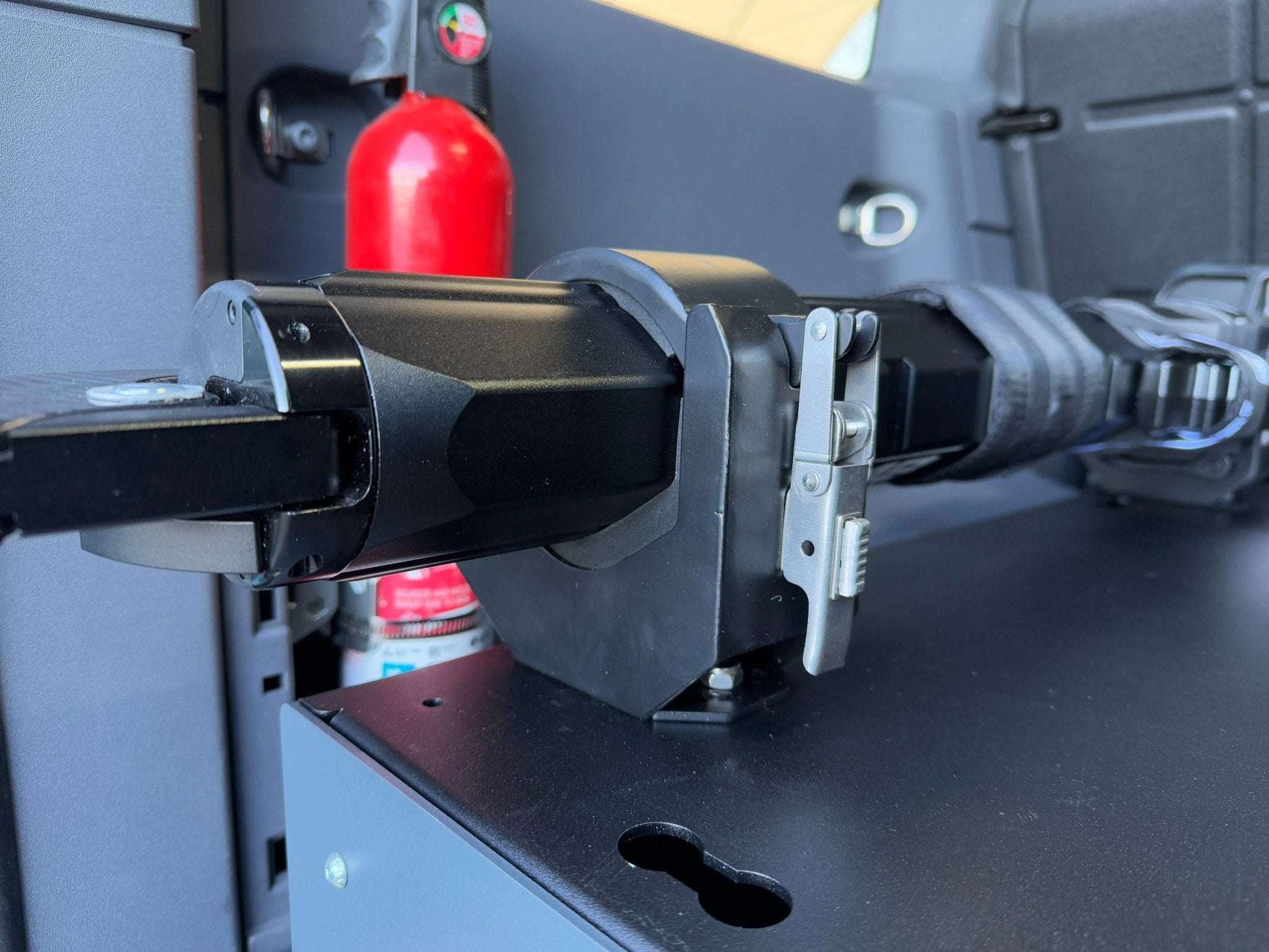 Hydraulic jack and mounts on INEOS Grenadier interior.