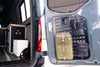 Rear door modular MOLLE storage panel mounted on Mercedes Sprinter 2019+ with attached tactical pouches and gear organization system.