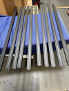 144 Sprinter Baja Roof Rack crossbars laid out on a blue protective blanket.
