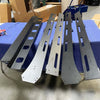 144 Sprinter Baja Roof Rack open box components laid out on a blue padded surface in a workshop.