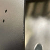 Close-up of a black 144 Sprinter Baja Roof Rack with visible scuffs and scratches on the surface