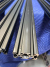 Close-up of metal crossbars for 144 Sprinter Baja Roof Rack showing T-slotted design for accessory mounting