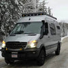 144 Sprinter Baja Roof Rack mounted on a white Sprinter van equipped with LED light pods, designed for off-road and adventure use.