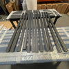 170" Backroad Innovations Sprinter Baja Roof Rack crossbars laid out on a table in a warehouse setting