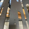 Close-up view of 170" Backroad Innovations Sprinter Baja Roof Rack crossbars with textured black powder coat finish and mounting holes.