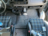 Sprinter front floor mats with custom fit and snap-in system, shown installed in van interior.