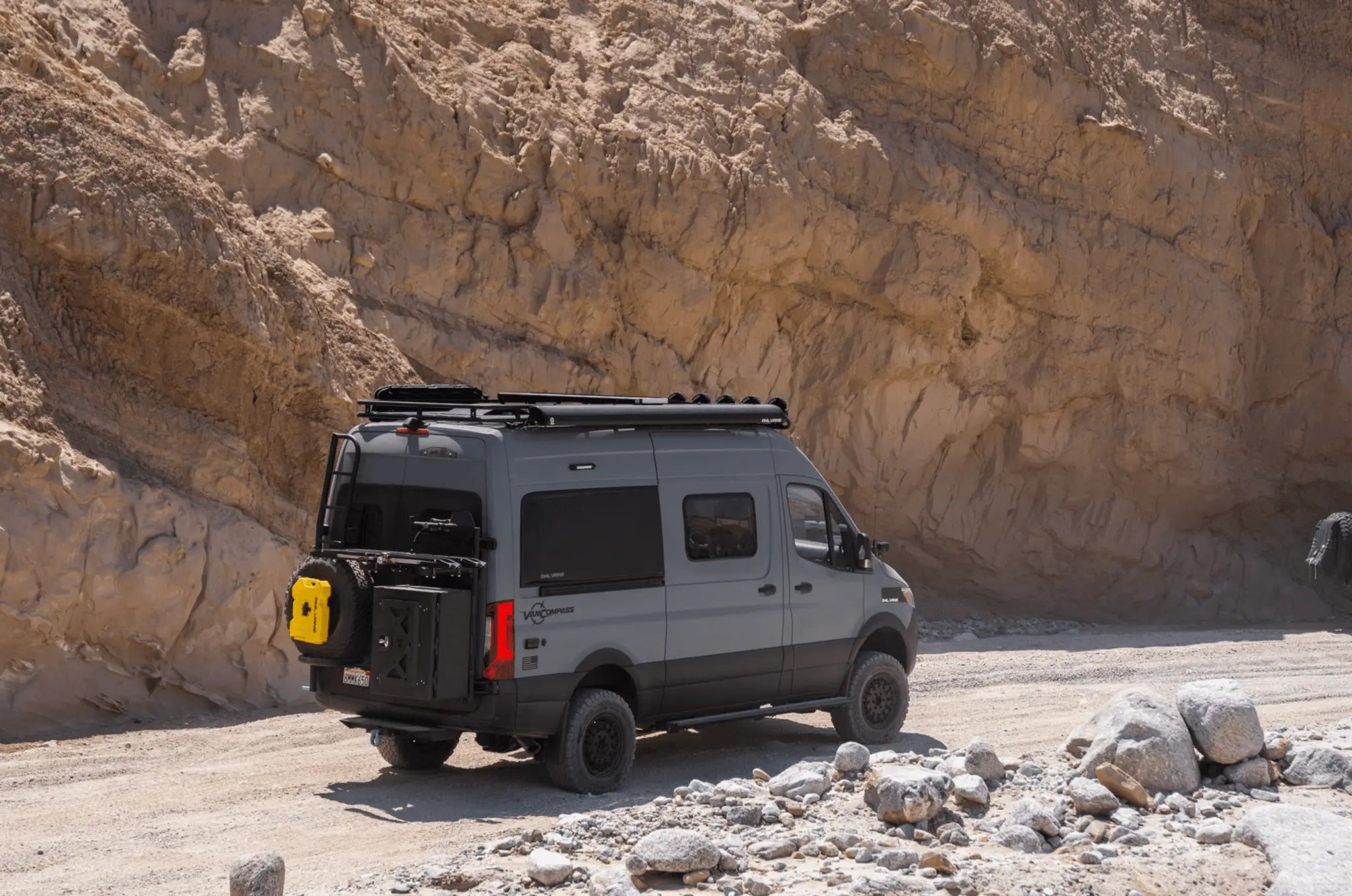 Bike rack for Sprinter with Owl B2 Classic carrier on a rugged trail.