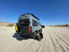 Bike rack and box carrier for Sprinter van in sandy terrain with user fitting tire.
