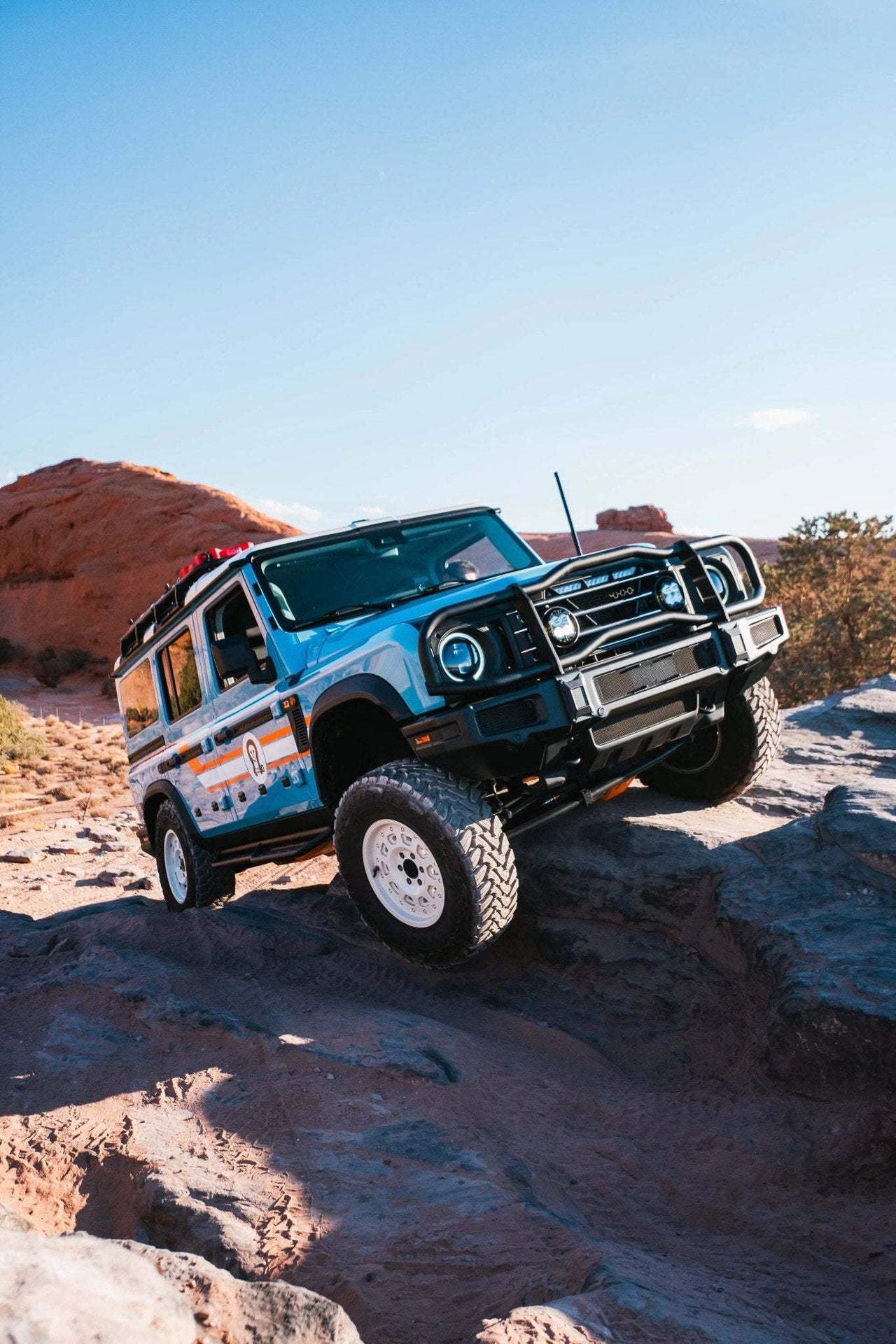 Off-road vehicle equipped with a durable Grenadier Bullbar Roo Bar in rugged terrain