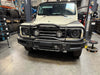 Bullbar Roo Bar on INEOS Grenadier in workshop setting.