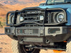 Bullbar Roo Bar for INEOS Grenadier on rugged terrain, showcasing durability and seamless integration.