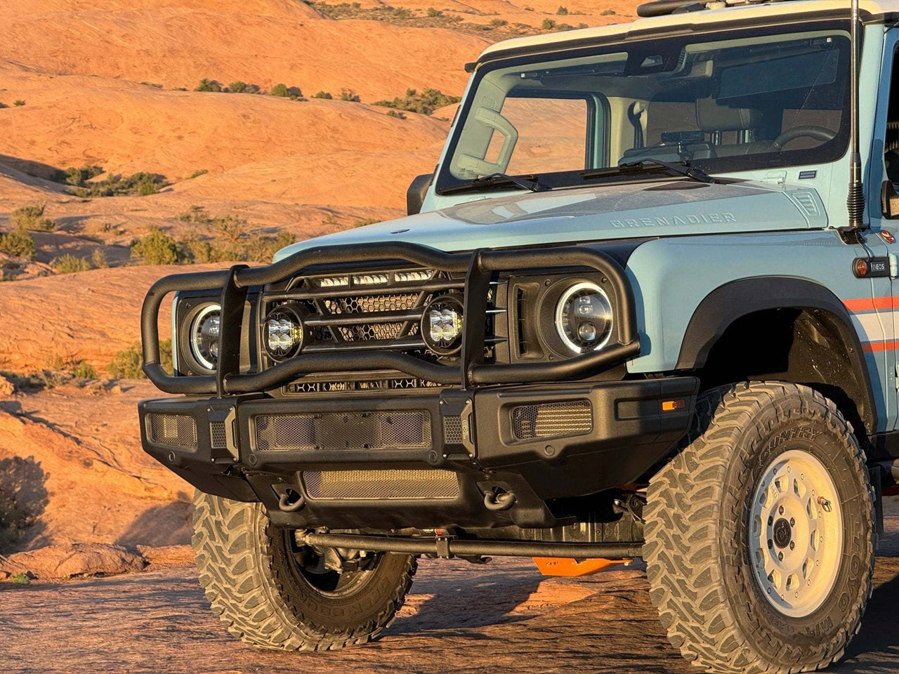 Grenadier Bullbar installed on blue off-road INEOS Grenadier vehicle in desert setting