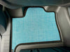 Custom floor mats for INEOS Grenadier in vehicle, tailored fit for protection and comfort.