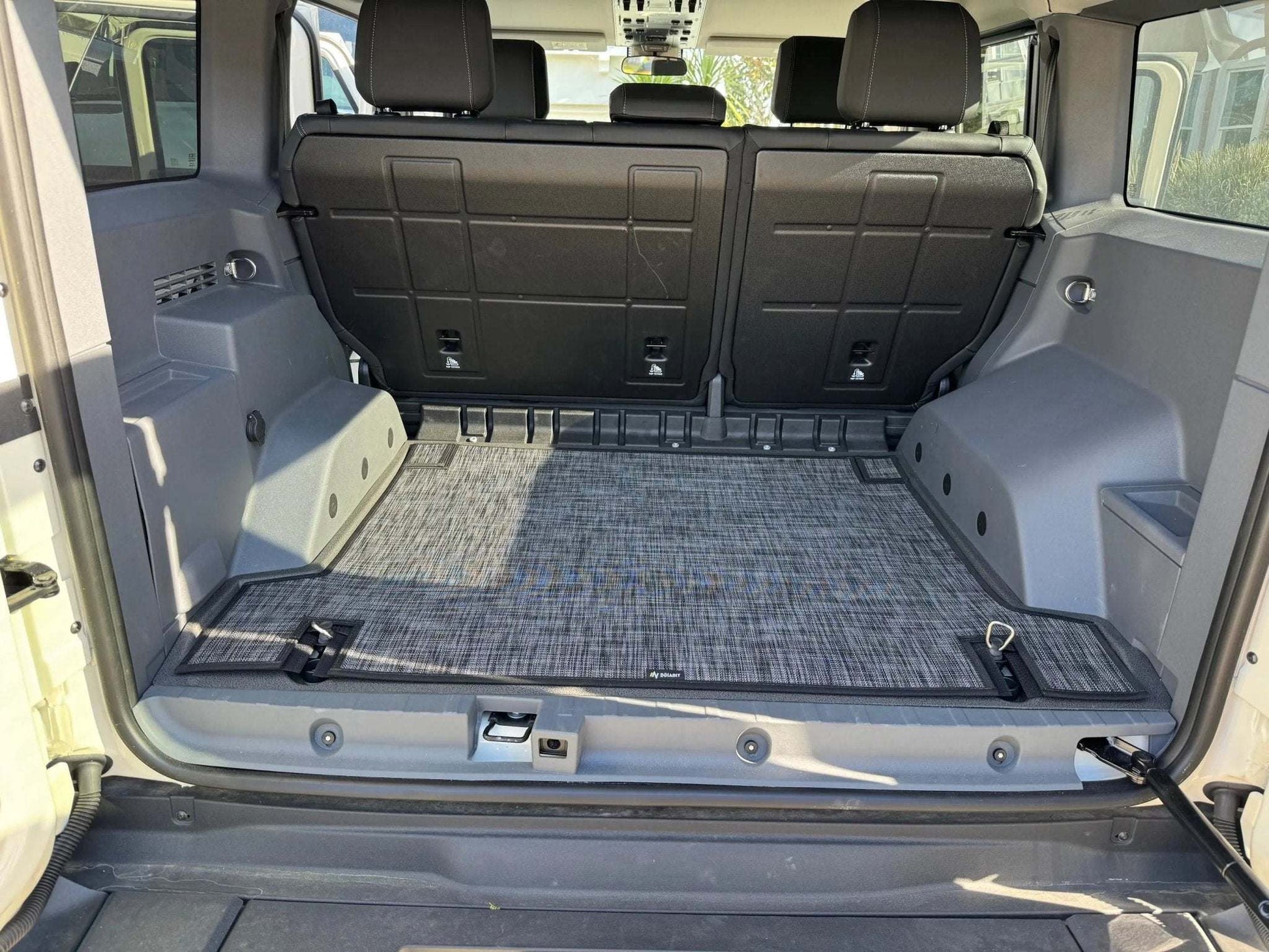 Custom floor mats for INEOS Grenadier, providing comfort and protection for vehicle interior.