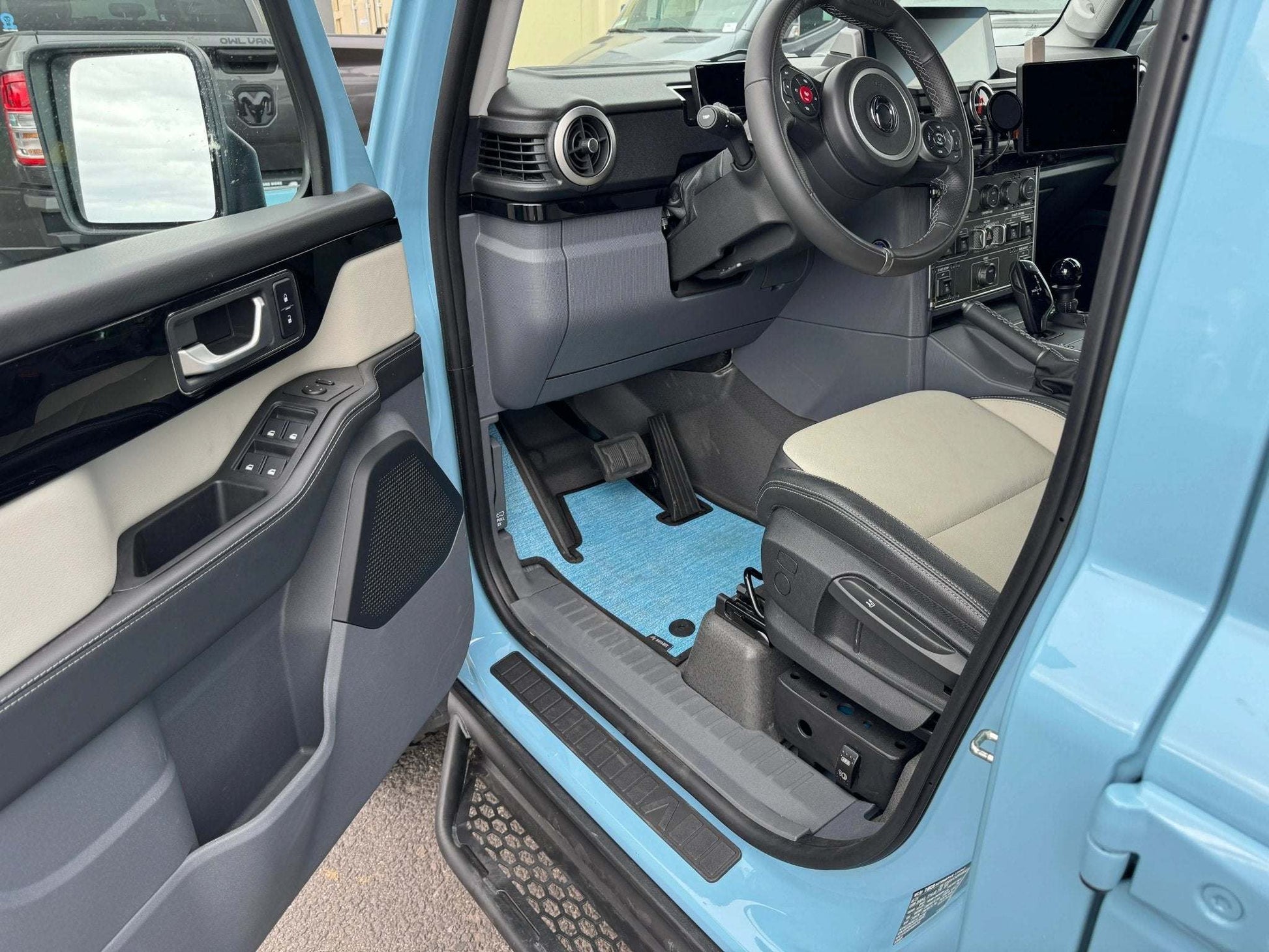 Custom floor mats for INEOS Grenadier interior, offering comfort and protection.