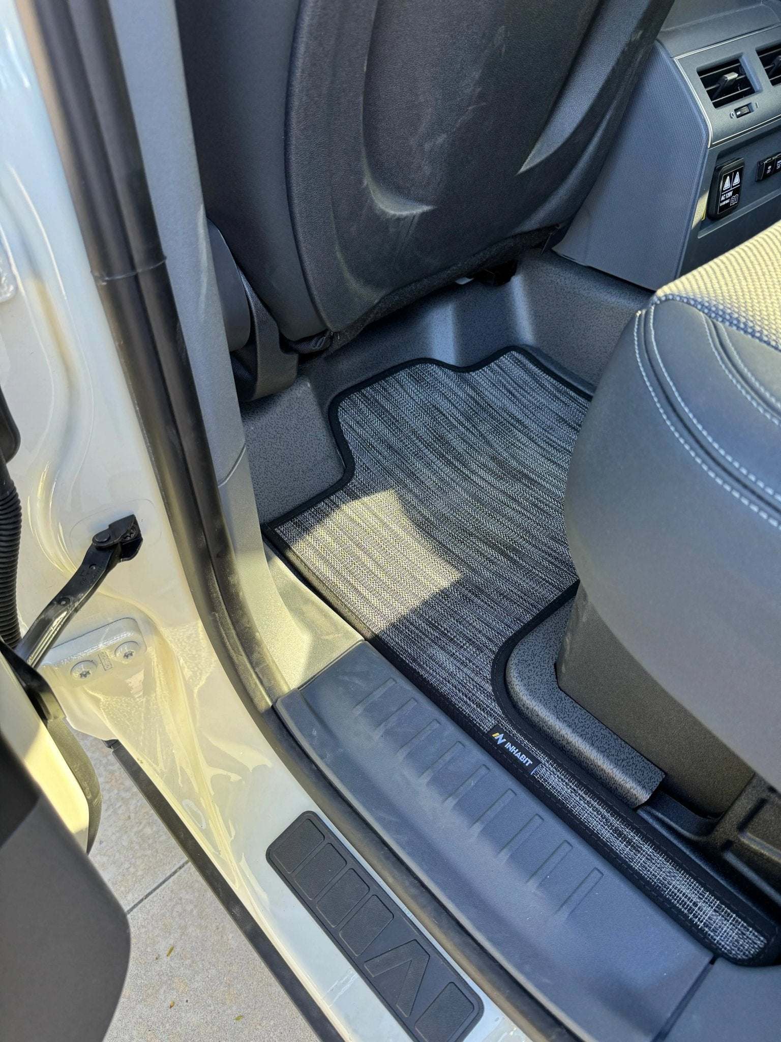 Custom floor mats for INEOS Grenadier, tailored fit, durable, dirt-trapping, and easy to clean.