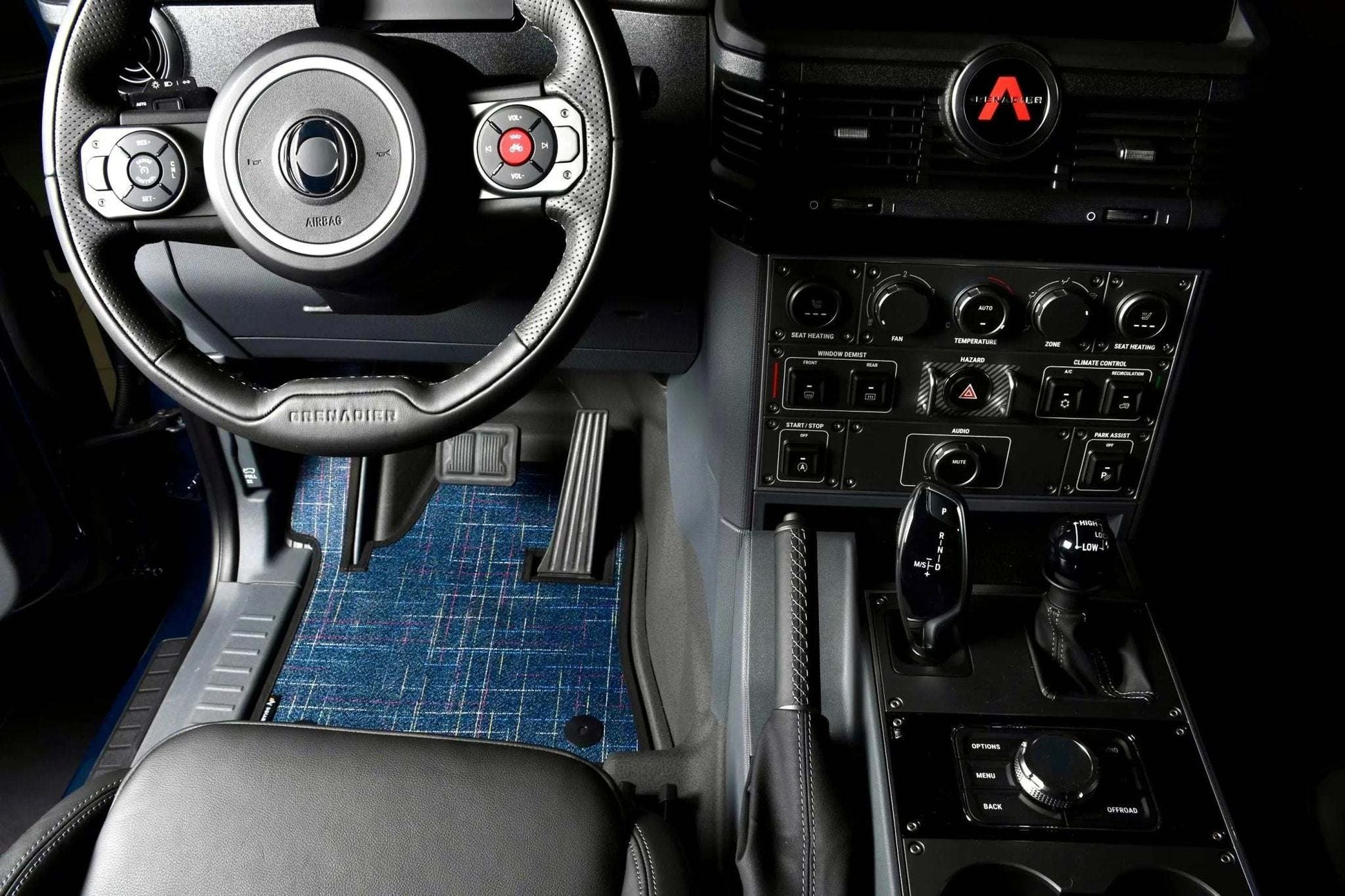 Custom floor mats for INEOS Grenadier interior, providing comfort and protection.