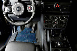 Custom floor mats for INEOS Grenadier interior, providing comfort and protection.