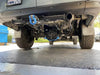 Underneath view of Sprinter van showing installed differential skid plate for protection.