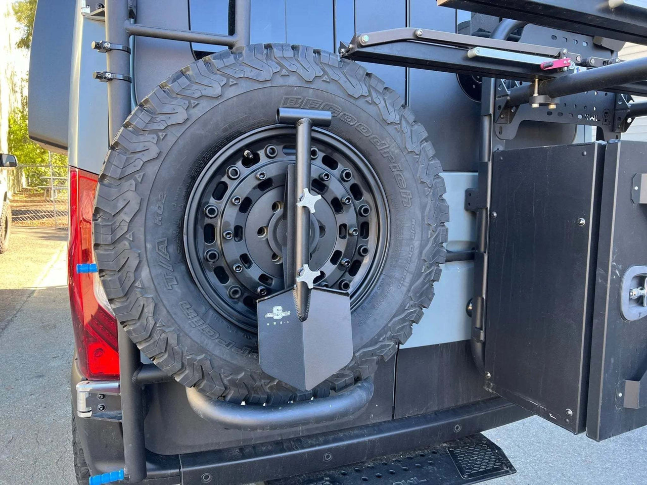 Expedition Handle 2.0 mounted on Owl ladder and tire carrier with shovel attached