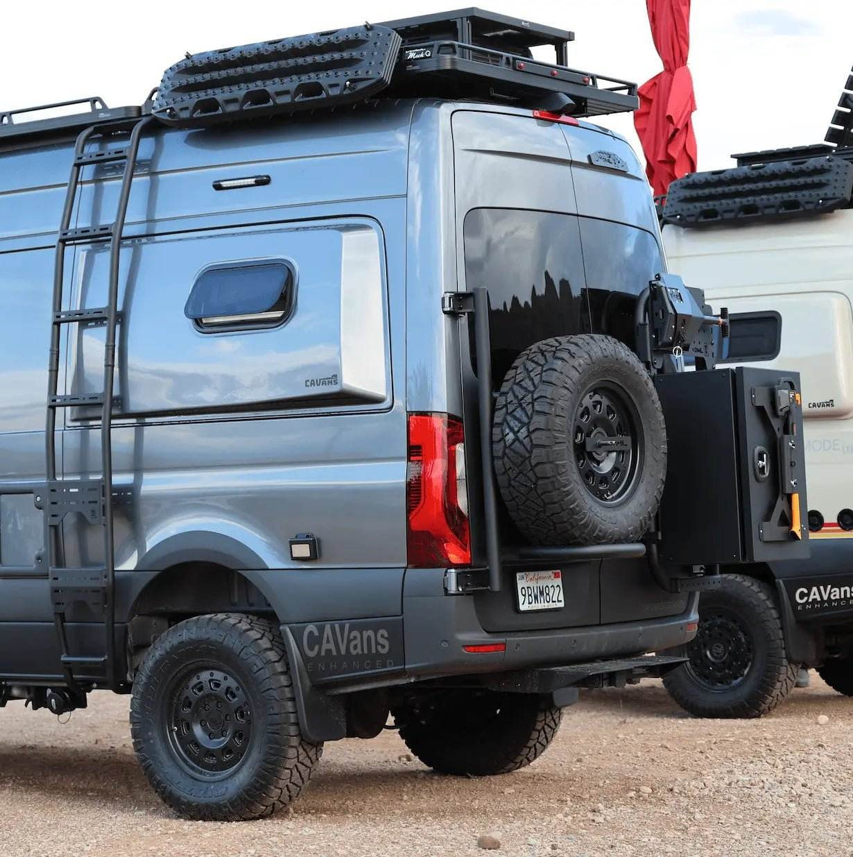 Expedition Tire Carrier mounted on 2019+ Sprinter van, showcasing durable rear setup for oversized tires.