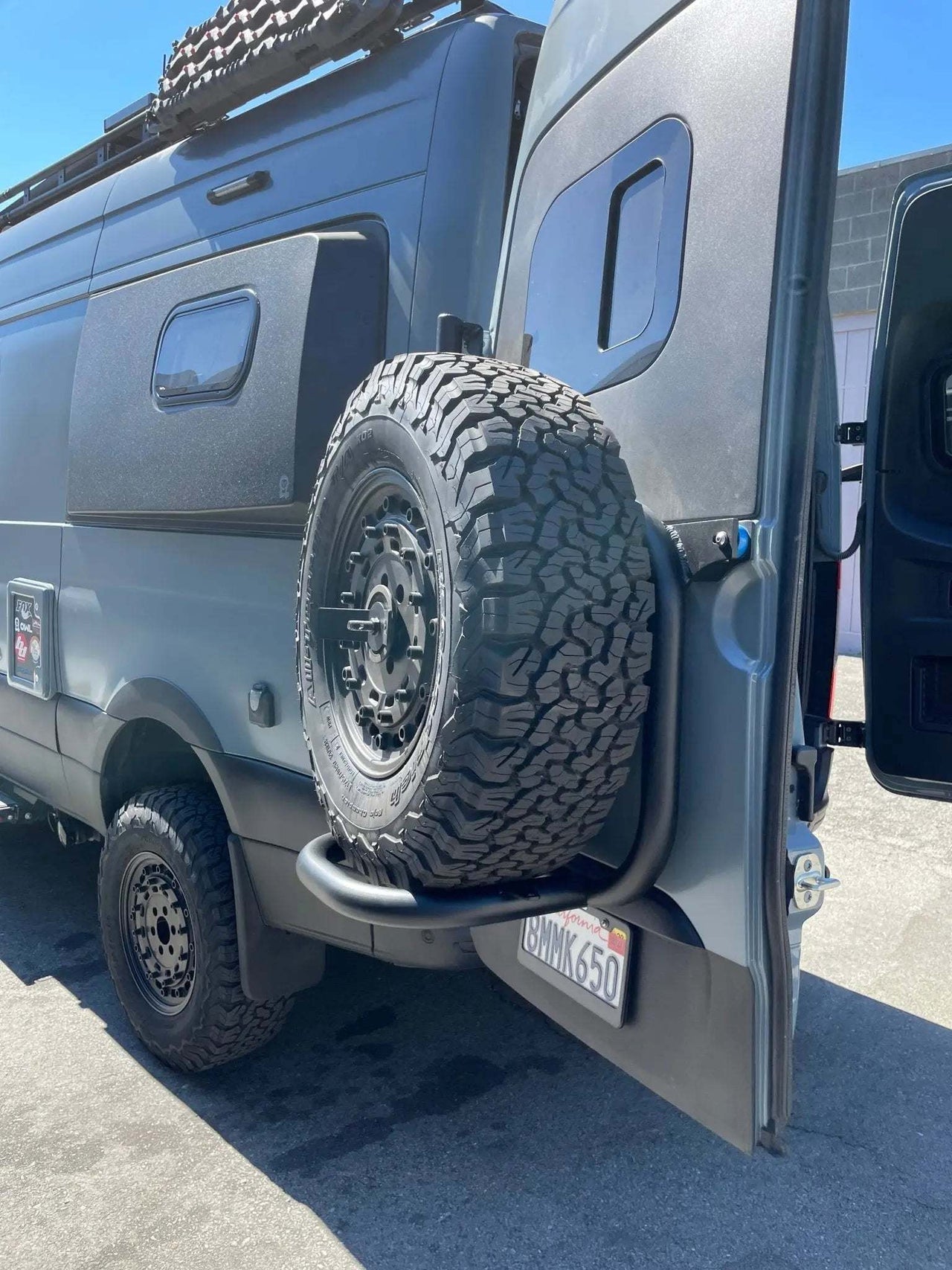 Sprinter Rear Door Tire Carrier with off-road spare tire and open rear door