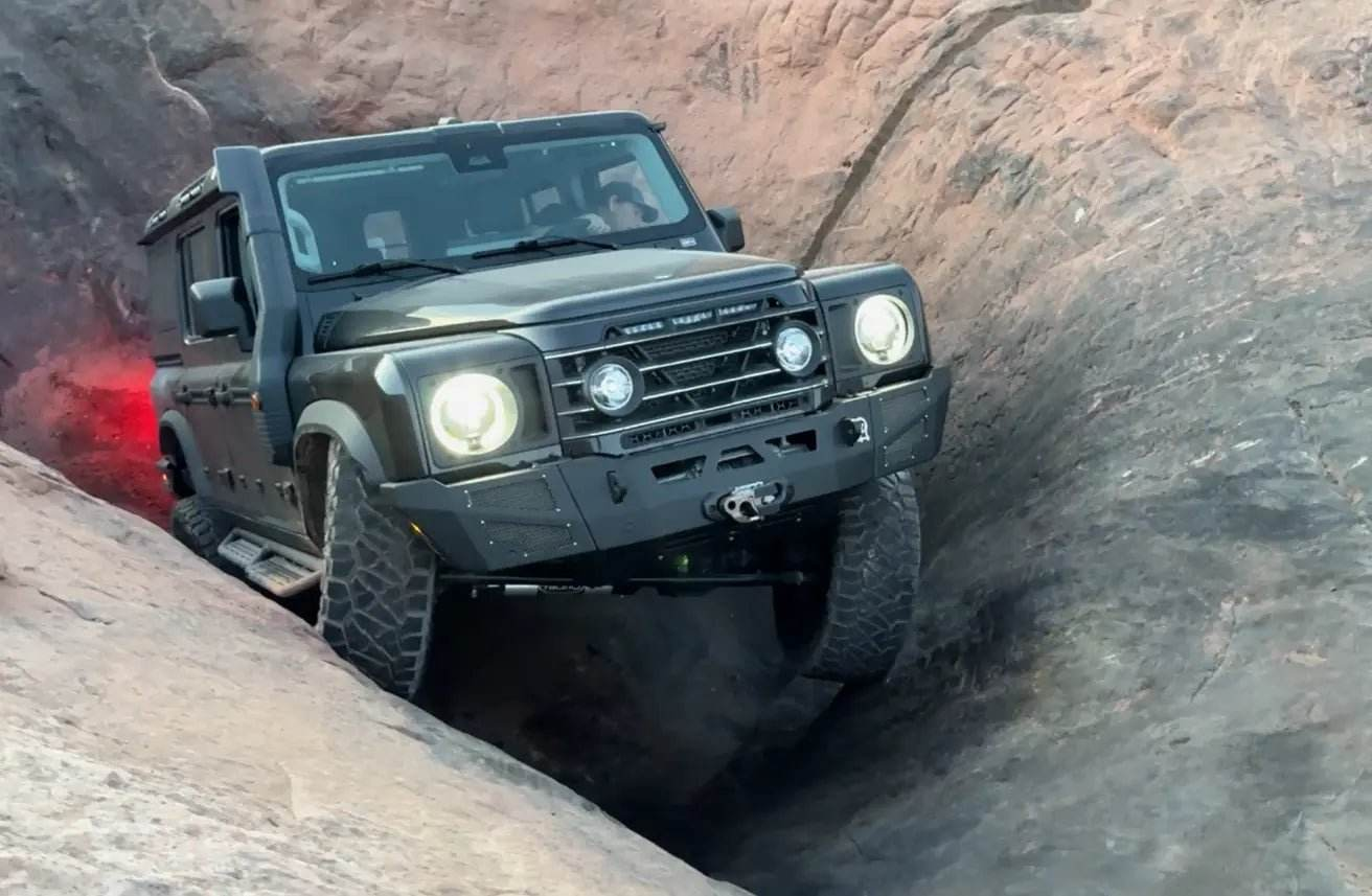 Highline Winch Bumper on INEOS Grenadier navigating rocky terrain.