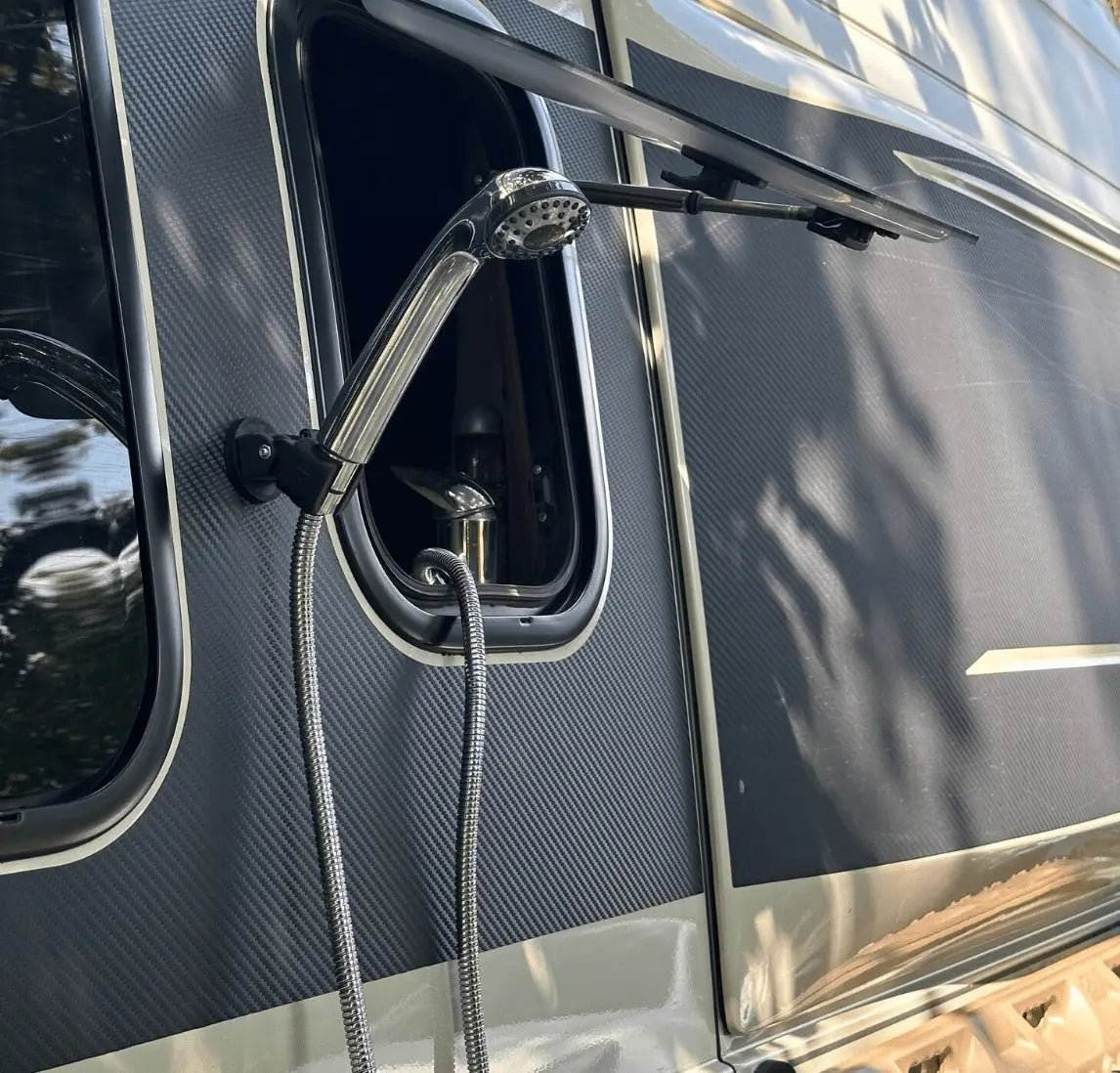 Magnetic Shower Handle Holder attached to an outdoor vehicle setup.
