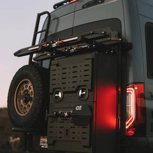 Van Storage Box Monster 40 mounted on rear door of off-road van with fold-down work station and secure storage features.