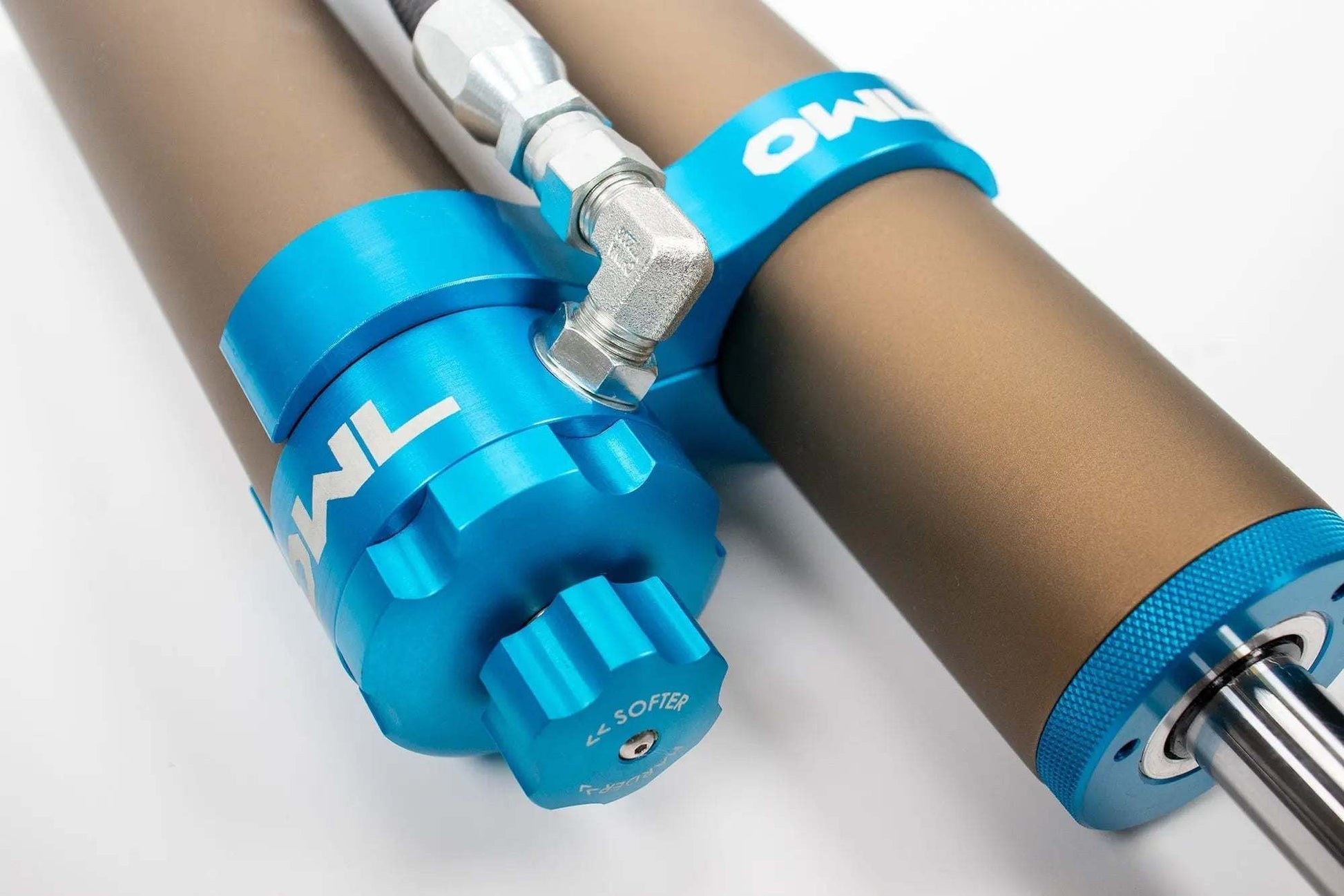 Grenadier Suspension - Close-up of Owl 4" Lift TrailFlo Suspension shock absorber with blue anodized components for INEOS vehicles