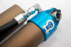 Grenadier Suspension - Close-up of Owl 4" Lift TrailFlo Suspension component with blue anodized part and hose fitting for INEOS Grenadier off-road vehicle upgrade