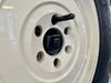 Rear Camera Relocation Kit with Harness for INEOS Grenadier installed on wheel.
