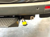 Retractable bike and gear lock attached to vehicle for adventure use.