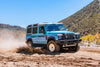 Talon Wheels on INEOS Grenadier driving off-road in rugged terrain.