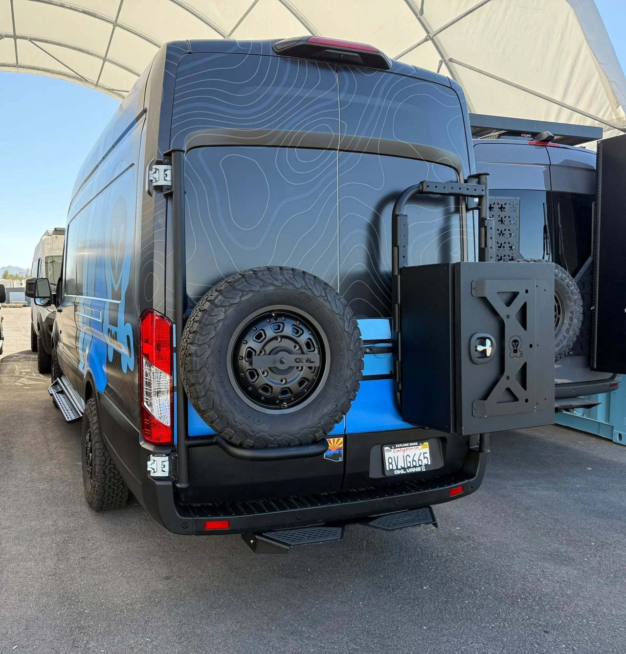 Owl rear door spare tire carrier mounted on the doors of a Ford Transit