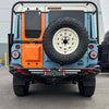 Tire Relocation Bracket for INEOS Grenadier on vehicle rear, showcasing durability and seamless integration.