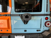 Tire relocation bracket installed on INEOS Grenadier rear door.