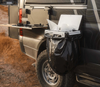 Trail Trash Magnetic Overlanding Trash Holder attached to a vehicle, designed for durability and off-grid living.